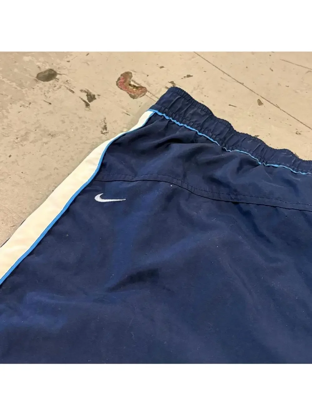 Super fire vintage early 2000s Nike grey tag swim trunks.